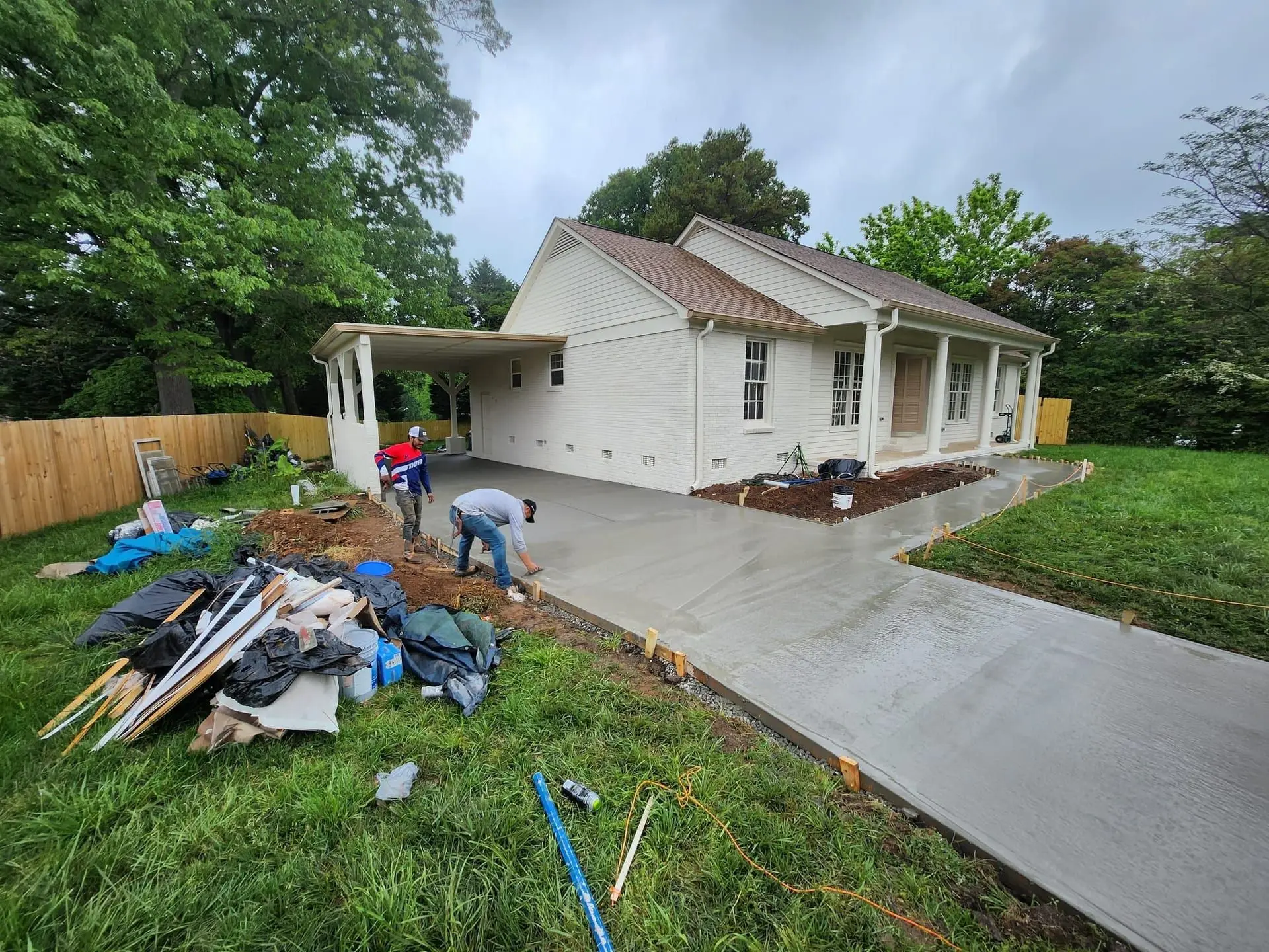 Finished home and driveway Finished NIMAS home with painted siding, attached carport and a newly poured concrete driveway