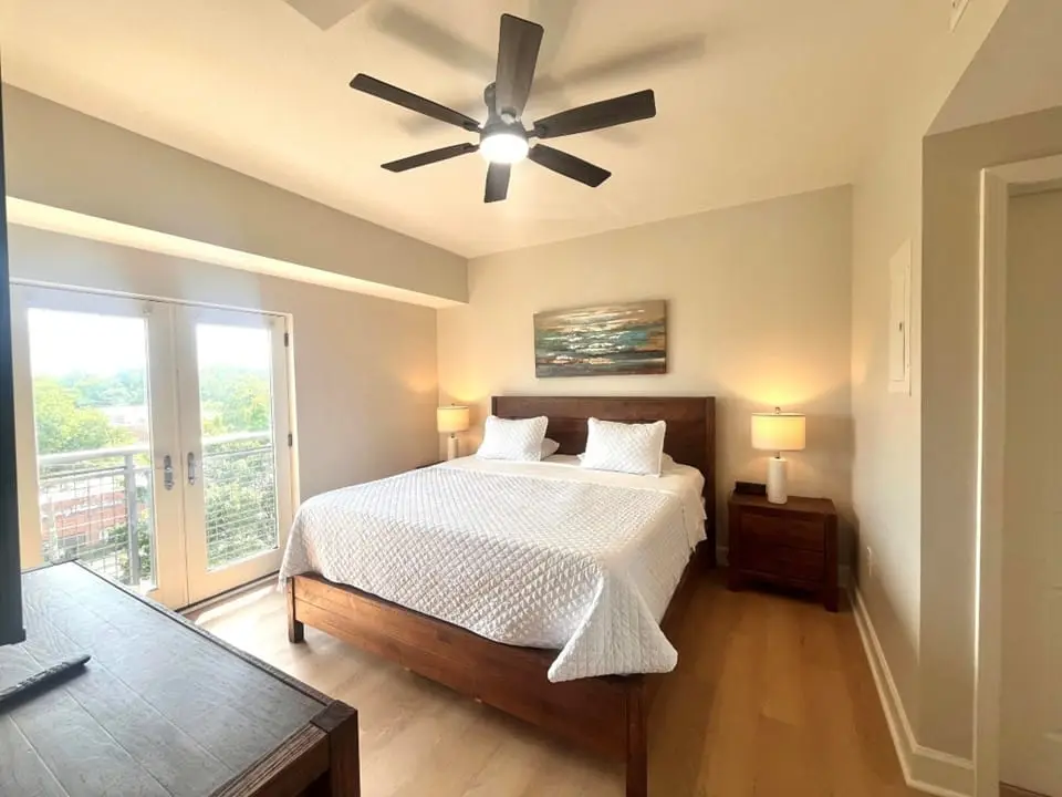 Primary bedroom opening to a covered patio